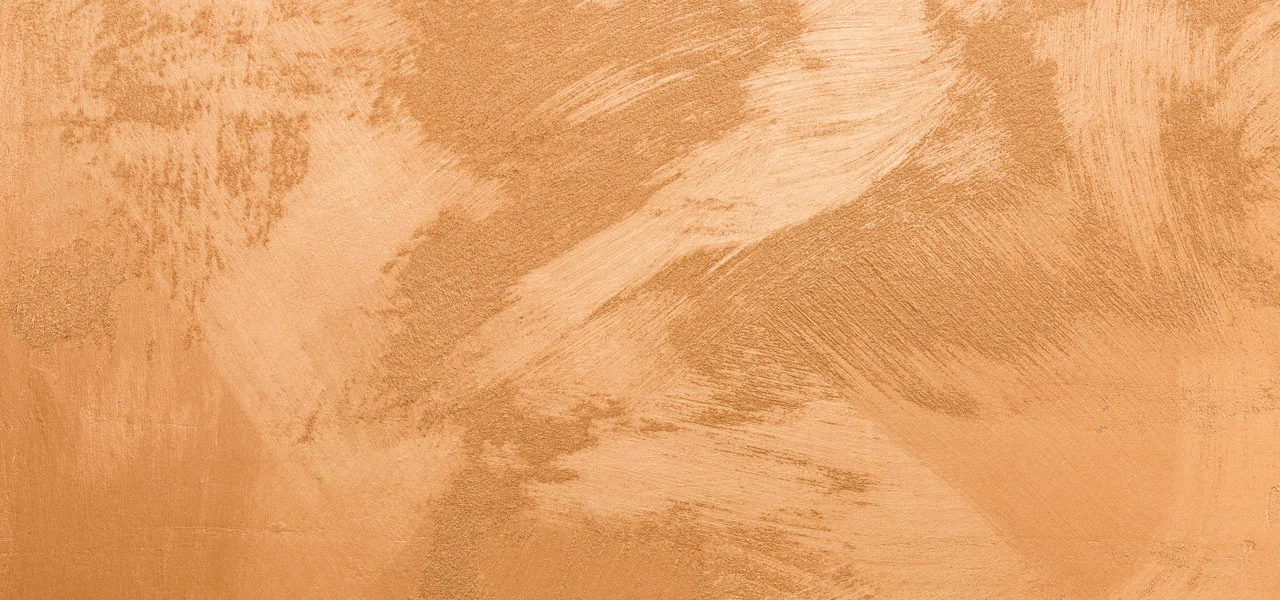 Nahaufnahme der metallischen Wandfarbe - kupfer