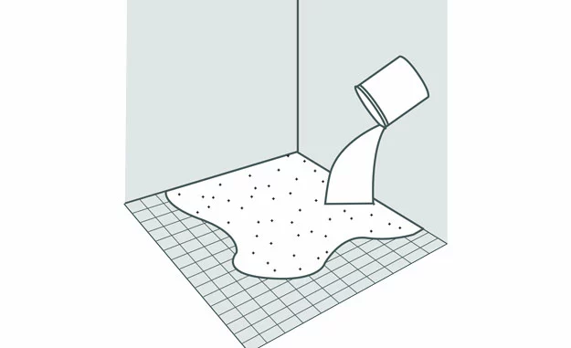 Nivelliermasse wird auf den unebenen Boden geschüttet, um den Boden für den Microzement vorzubereiten